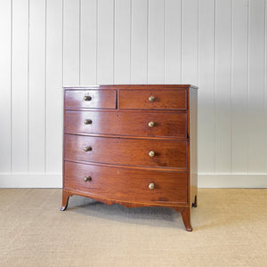 A Large Antique English Bow Front Mahogany Chest of Drawers