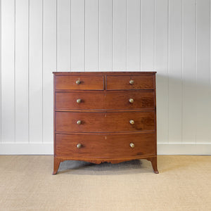A Large Antique English Bow Front Mahogany Chest of Drawers