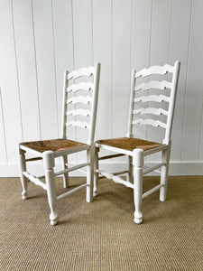 A Pair of Ladderback Rush Seat Chairs Painted White