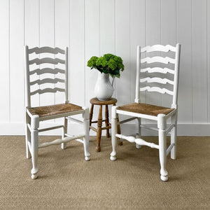 A Pair of Ladderback Rush Seat Chairs Painted White