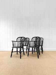 A Set of Four Black Windsor Armchairs