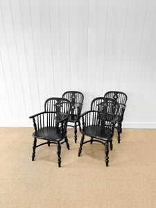 A Set of Four Black Windsor Armchairs