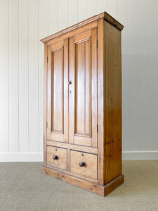 A Handsome English 19th Pine Cupboard with Dark Wooden Knobs
