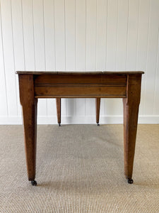 An Antique English Country Pine 6ft Dining Table on Casters