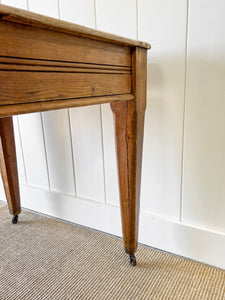 An Antique English Country Pine 6ft Dining Table on Casters