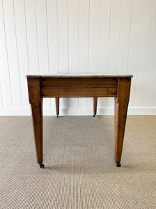 An Antique English Country Pine 6ft Dining Table on Casters