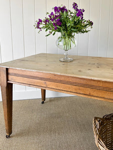 An Antique English Country Pine 6ft Dining Table on Casters