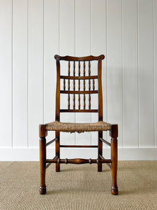 A Vintage Set of 6 English Oak Spindle Back Chairs with Rush Seats