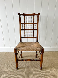 A Vintage Set of 6 English Oak Spindle Back Chairs with Rush Seats