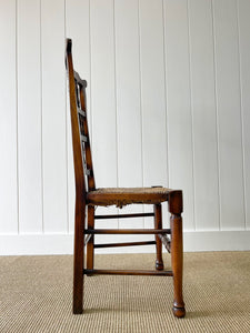 A Vintage Set of 6 English Oak Spindle Back Chairs with Rush Seats