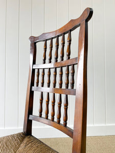A Vintage Set of 6 English Oak Spindle Back Chairs with Rush Seats