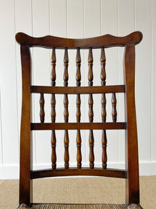 A Vintage Set of 6 English Oak Spindle Back Chairs with Rush Seats