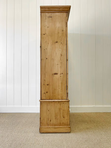 A Handsome English 19th Pine Cupboard with Dark Wooden Knobs