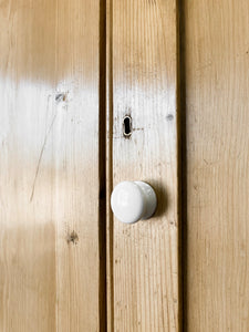 A Handsome English 19th Pine Cupboard with Dark Wooden Knobs