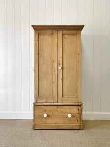 A Handsome English 19th Pine Cupboard with Dark Wooden Knobs
