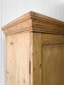 A Handsome English 19th Pine Cupboard with Dark Wooden Knobs