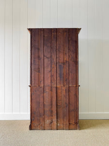 A 19th Century English Pine Bookcase with Arched Doors