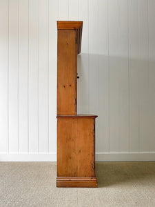 A 19th Century English Pine Bookcase with Arched Doors