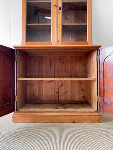 A 19th Century English Pine Bookcase with Arched Doors