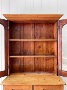 A 19th Century English Pine Bookcase with Arched Doors