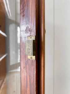A 19th Century English Pine Bookcase with Arched Doors