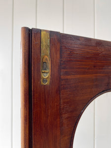 A 19th Century English Pine Bookcase with Arched Doors