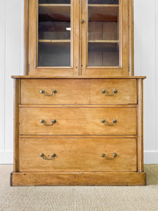 A 19th Century English Pine Bookcase with Arched Doors