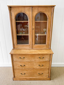 A 19th Century English Pine Bookcase with Arched Doors