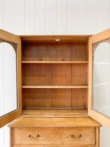 A 19th Century English Pine Bookcase with Arched Doors