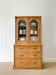 A 19th Century English Pine Bookcase with Arched Doors