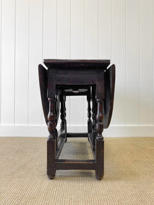 An Antique English Country Oak Drop Leaf Gate Leg Table