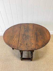 An Antique English Country Oak Drop Leaf Gate Leg Table