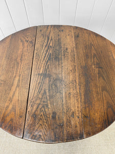 An Antique English Country Oak Drop Leaf Gate Leg Table