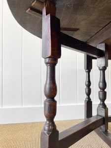 An Antique English Country Oak Drop Leaf Gate Leg Table