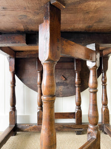 An Antique English Country Oak Drop Leaf Gate Leg Table