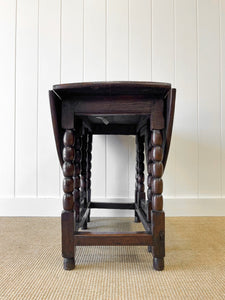 An Antique English Country Oak Drop Leaf Gate Leg Table