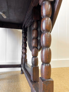 An Antique English Country Oak Drop Leaf Gate Leg Table