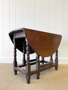 An Antique English Country Oak Drop Leaf Gate Leg Table