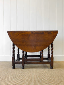 An Antique English Country Oak Drop Leaf Gate Leg Table