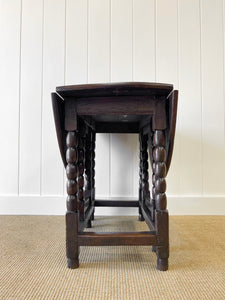 An Antique English Country Oak Drop Leaf Gate Leg Table