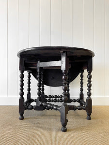 An Antique English Country Oak Drop Leaf Gate Leg Table