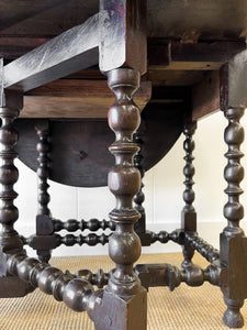 An Antique English Country Oak Drop Leaf Gate Leg Table