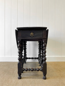 An Antique English Country Oak Drop Leaf Gate Leg Table