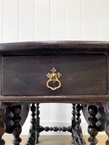 An Antique English Country Oak Drop Leaf Gate Leg Table