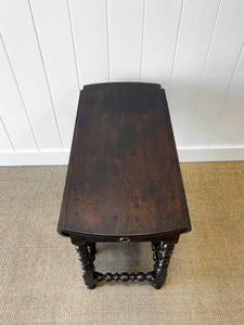 An Antique English Country Oak Drop Leaf Gate Leg Table