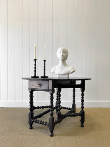An Antique English Country Oak Drop Leaf Gate Leg Table