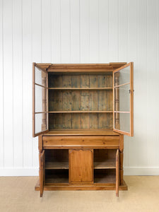 A 19th Century English Pine Bookcase Cabinet or Hutch with Glazed Doors