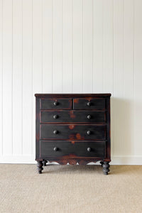 An Ebonized Antique English Chest of Drawers/Dresser