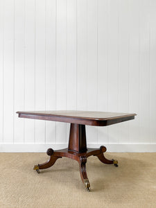An English Mahogany Breakfast Table with Castors