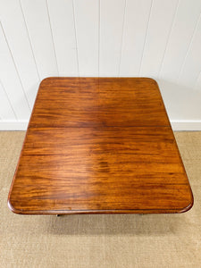 An English Mahogany Breakfast Table with Castors